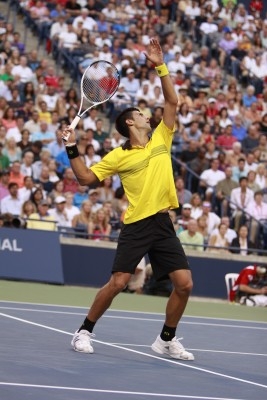 Djokovic Executing A Tennis Smash